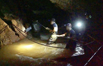 Rescuers search for Thai footballers, their coach missing in cave